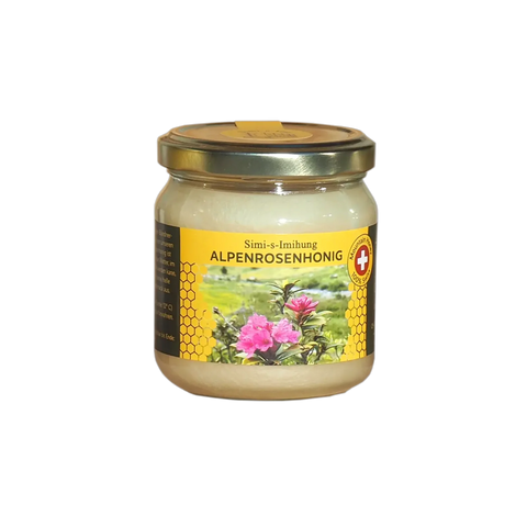 ein helles gefülltes Alpenrosenhonig Glas mit einer ansprechenden gelb grünen Etikette auf der eine pinke Alpenrose abgebildet ist. Hochwertiger Gebirgshonig mit feinem 100% Swiss Mountain Honey