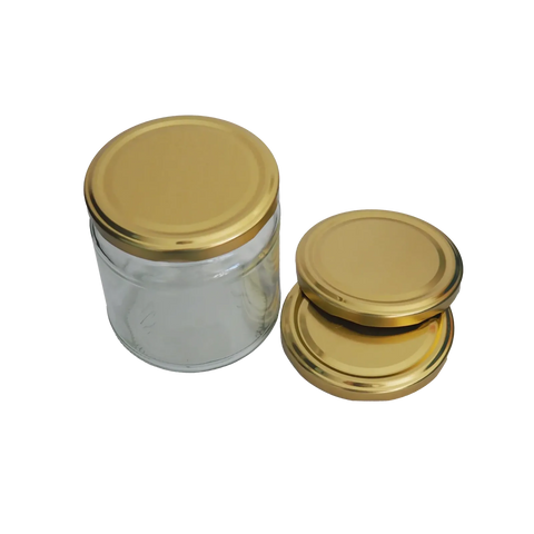 leeres Honigglas mit 3 goldenen Metalldeckeln
